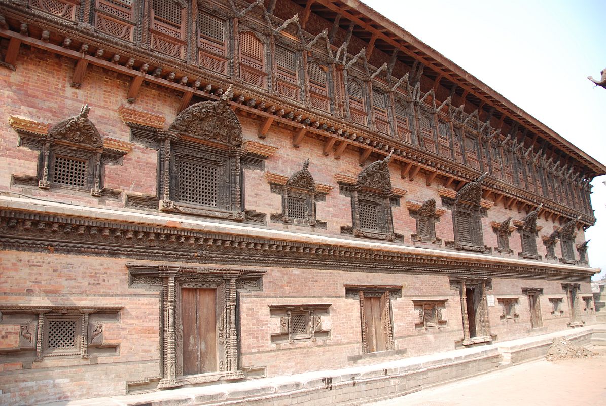 Kathmandu Bhaktapur 03-1 Bhaktapur Durbar Square Palace Of 55 Windows The Palace of 55 Windows in Bhaktapur�s Durbar Square is actually the east wing of the Royal Palace, constructed in the 17C of red brick and featuring 55 black, artfully-carved wooden windows.